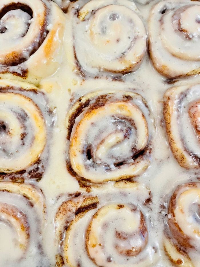 A tray of iced cinnamon rolls